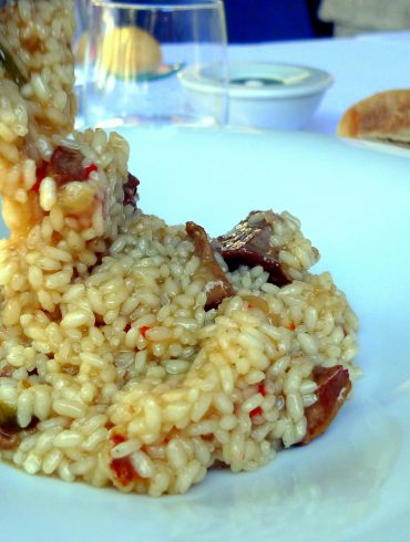 Arroz meloso de gallo y secreto ibérico